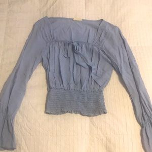 Light blue trendy Victorian shirt this could be a small medium or large